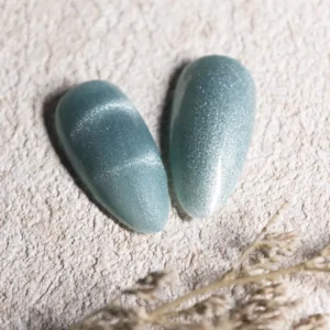 Crystal Cat Eye Gel Polish in dusty teal with a luminous magnetic streak