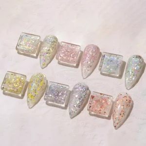 Iridescent nail gel polish shades under soft light on pink surface
