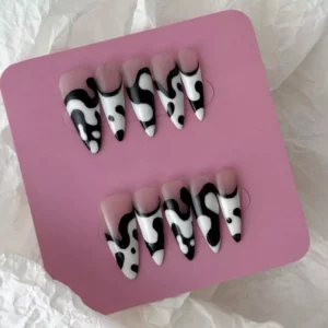 Monochrome abstract press-on nails in stiletto shape with glossy finish