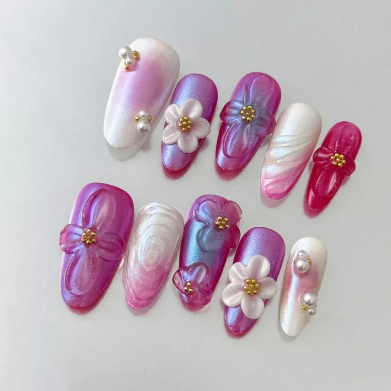 Mixed color iridescent press-on nails with sculpted 3D flowers and glossy finish