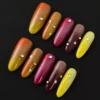 Multicolor Warm Tone Press-On Nails - Glossy Set with Star & Rhinestone Accents 4 Multicolor warm tone press-on nails with glossy finish and star rhinestone accents – front angle view