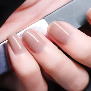 Nude beige jelly gel polish on natural square nails