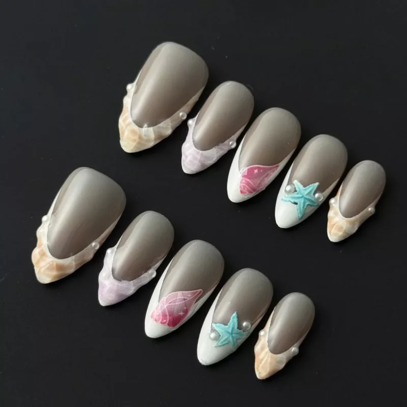 Nude mixed ocean press-on nails with 3D shell texture and pearl details – full set view