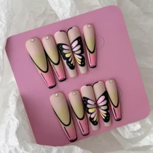 Butterfly Gradient Press-On Nails worn on hand, pink and yellow matte finish