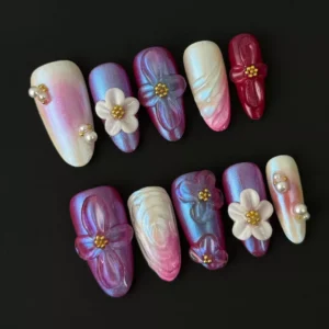 3D flower nail art with pearls on medium almond press-on nails – pastel gradient base