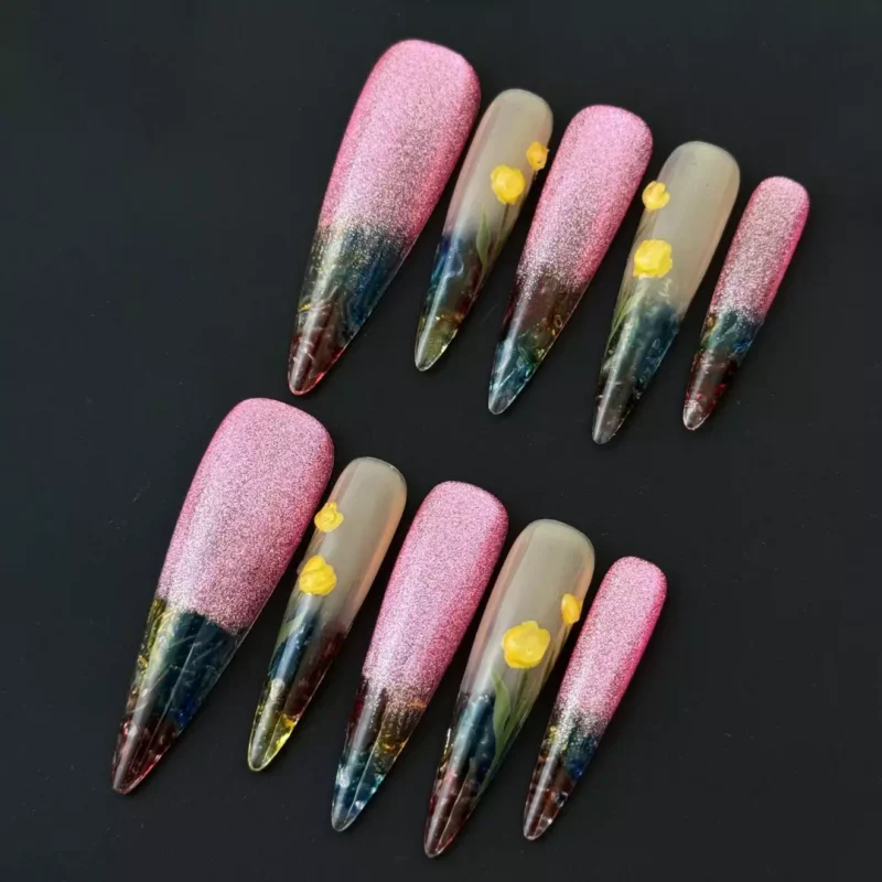 Pink glitter gradient press-on nails with transparent almond floral tips – front view