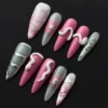 Pink Snake Press-On Nails in stiletto shape with glossy gradient and 3D star charm – front view