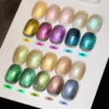 Magnetic prism gel polish swatches lined on chart paper in daylight for accurate tone display.