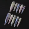 Purple Glacier Gradient Press-On Nails - Long Stiletto, Glitter Lily 6 Purple glacier gradient press-on nails with glitter lily details and stiletto shape – front angle view