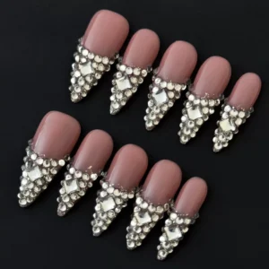 Rhinestone encrusted V-tip press-on nails with full rhinestone encrusted edges – front view