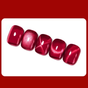 Set of five red cat eye gel nails in linear alignment on white base