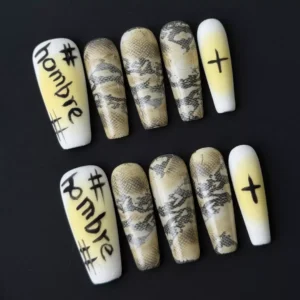 Side angle showing stiletto nail shape and chrome-accented graffiti design
