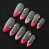 Sheer gold glitter French nails with pink rhinestone accents and star charms – front view