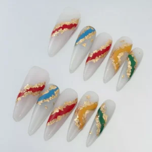 Sheer stiletto nails with multicolor foil accents and gold fragments