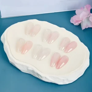 Pink jelly gel polish with high-gloss shine on short nails