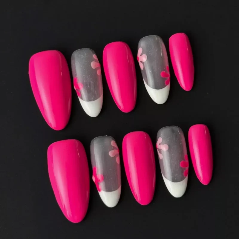 Side view of mixed hot pink press-on nails with white French tip and glossy finish