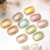 Soft pastel shades of Crystal Prism Cat Eye Gel with holographic reflections on white background.