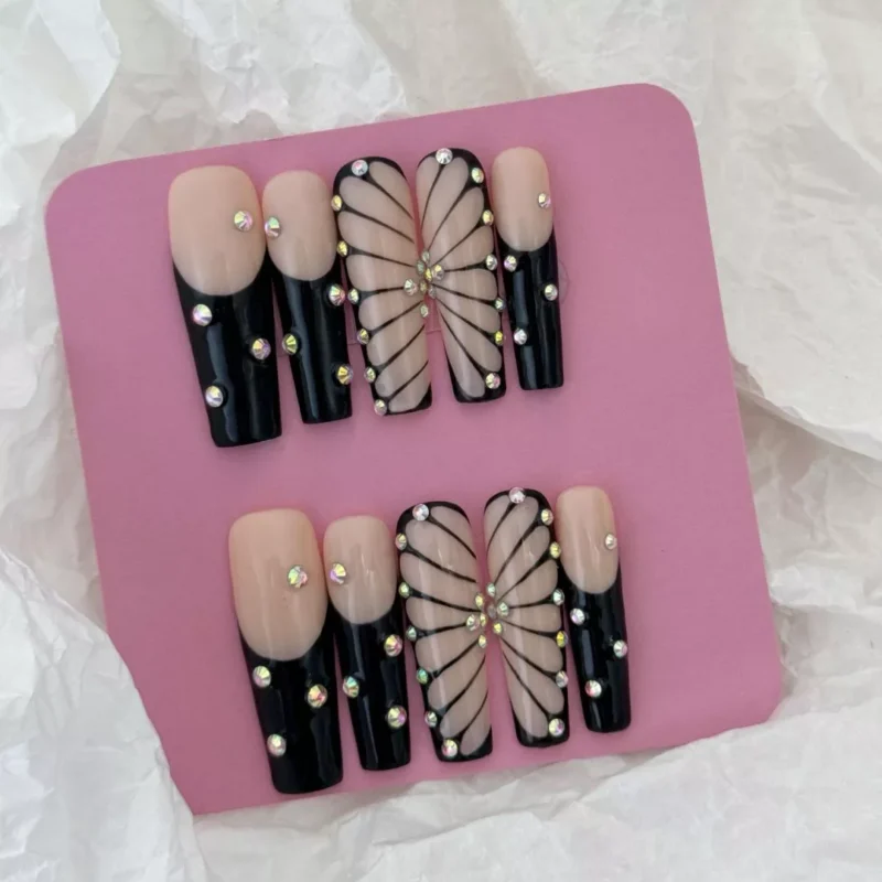 Square-shaped black butterfly press-on nails with glossy finish and minimalist design