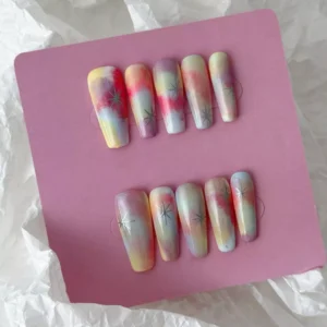 Star pattern ombre nails in soft pastel hues with a dreamy matte finish