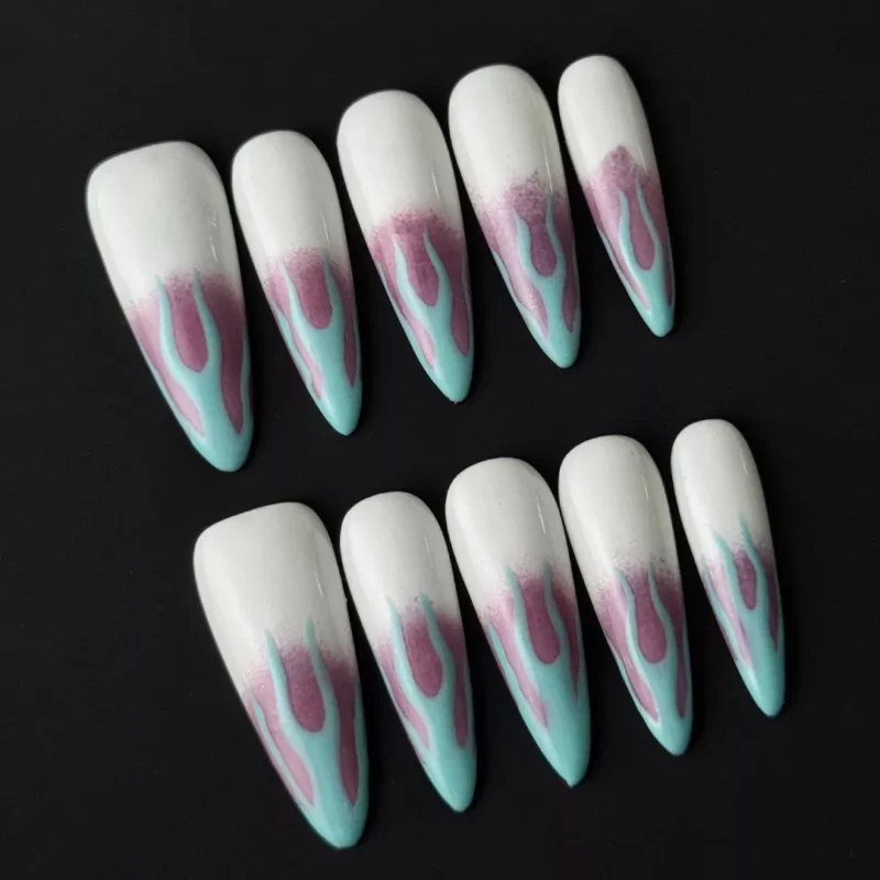 Side view of blue purple stiletto nails with flame nail art and clean white base