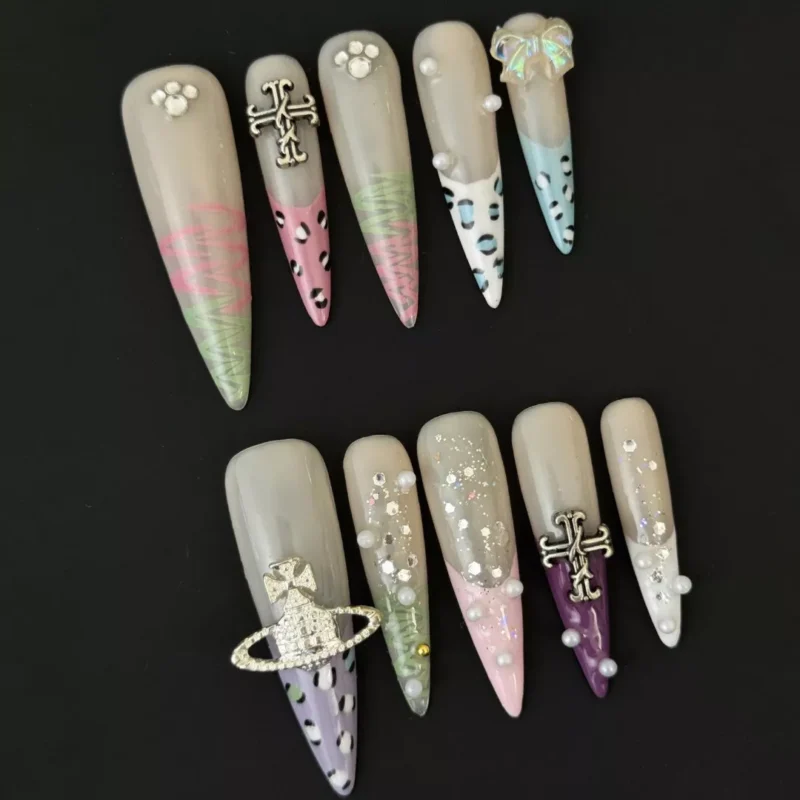 Artistic press-on nails with transparent nude base and multicolor glitter layers
