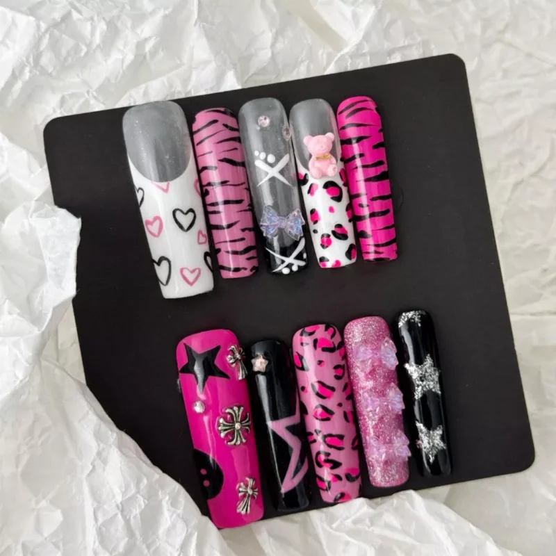 Stiletto view of Y2K press-on nails featuring leopard and star nail art