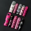 Y2K leopard print press-on nails with pink chrome base and 3D star charm – angled view