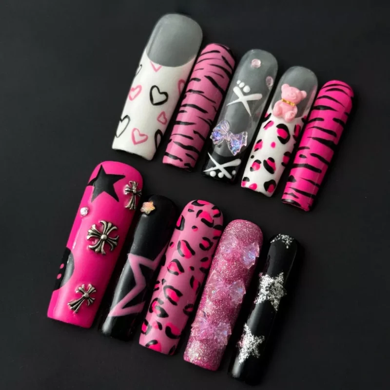 Y2K leopard print press-on nails with pink chrome base and 3D star charm – angled view