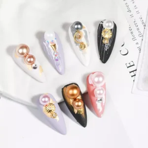Assorted press-on nails decorated with pearls and baroque alloy accents