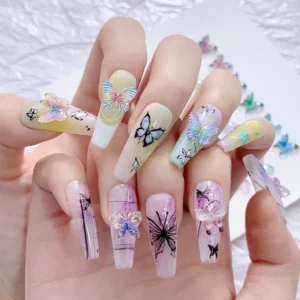 Hand showcasing nails with different butterfly nail charms in iridescent and transparent styles