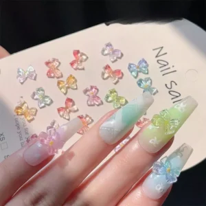 Jelly bow charms applied to nails over light gradients and plaid background