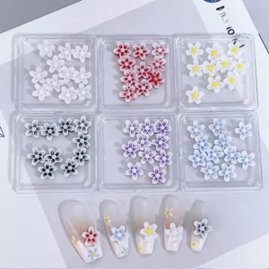 Vibrant layered flower nail decorations in bold and soft tones, featuring 3D finish