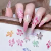 Lily Flower Nail Stickers in pink 3D design applied on almond nails with gradient tips