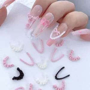 3D French lace nail trims in pink and white accenting long nude pink nails