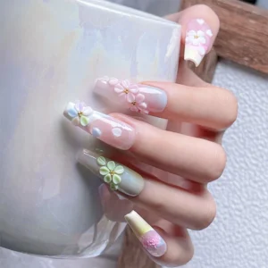 Elegant pastel floral nail art with gold accents