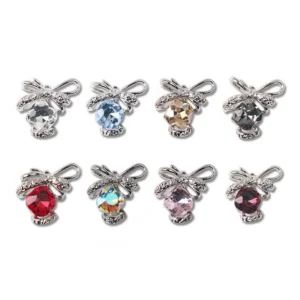 Eight Crystal Bow Nail Charms in vibrant color mix on a white background