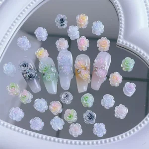 Iridescent gradient rose charms applied to artificial nails