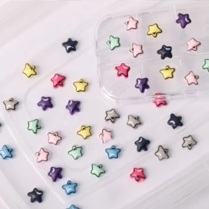 Box of 3D star-shaped Y2K nail charms in multicolor pastel and neon finishes