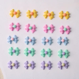 Color arrangement of pastel glow bow embellishments in five tones