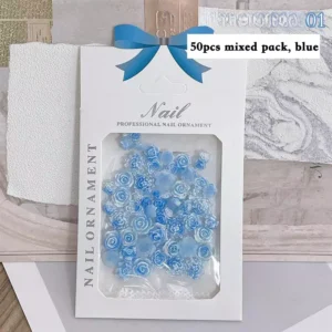50-piece blue resin rose nail charms in retail packaging