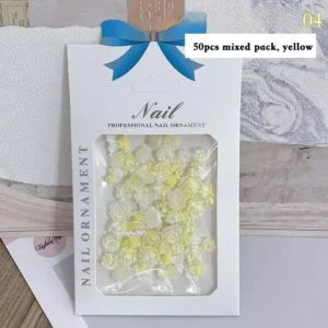 Yellow resin rose nail charms in 50-piece decorative set