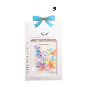 Iridescent glitter bow nail decorations in clear retail box