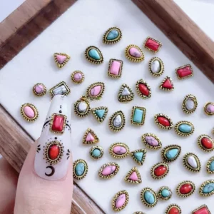 Assorted antique gemstone nail embellishments with red and blue stones
