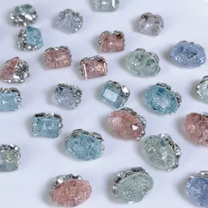 Assorted colorful rhinestone nail charms in different sizes and shapes