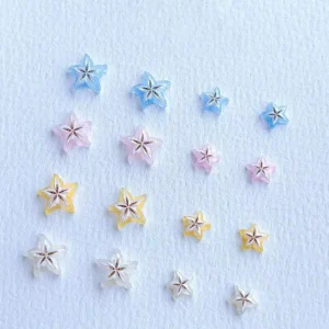 Small and large 3D resin starfruit nail charms in multiple pastel colors