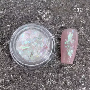 Green-blue reflective nail flake mix with aurora effect on pale base