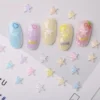 Aurora Pastel Nail Charms - Dreamy 3D Stars, Moons & Flowers 4 Aurora pastel nail charms applied on colorful kawaii manicures