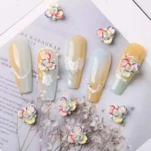 Iridescent Aurora Rose Nail Embellishments with multicolor outlines on soft yellow-blue nails