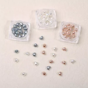 Baroque nail charms with heart shapes in silver, pearl white, and rose gold resin
