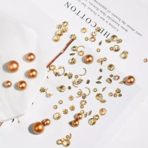 Pearl and alloy nail charms mixed with bronze pearls for vintage nail art